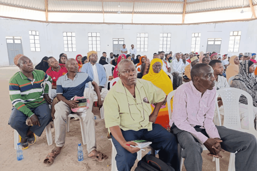 VSLAs and cooperative members attending the EDACR community meeting at Hola Social Hall, Tana River County.